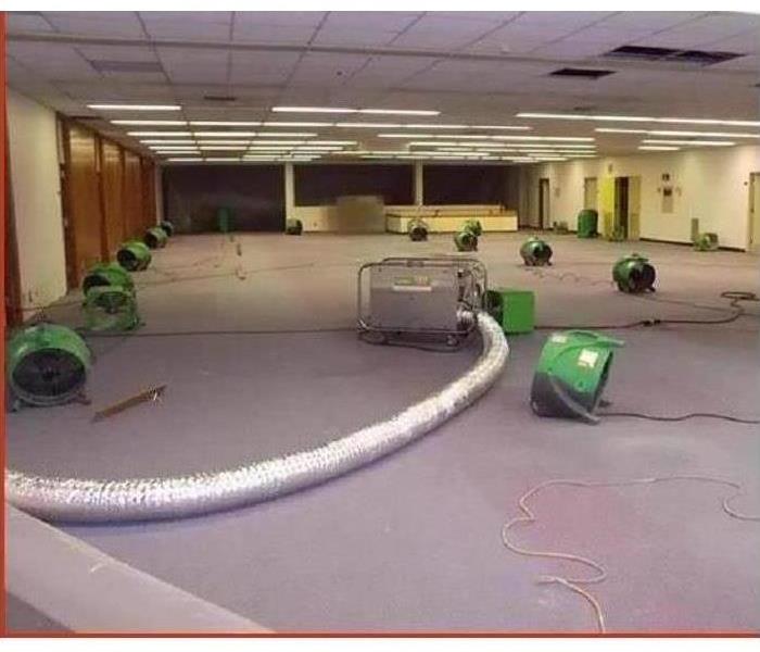 Commercial building with air movers drying out the room.