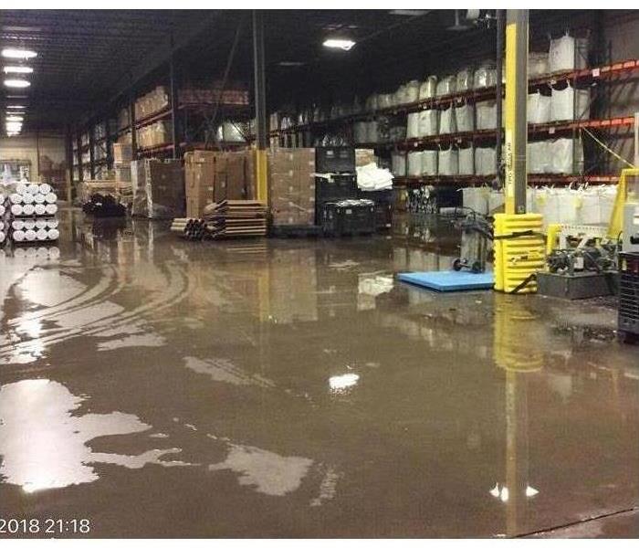 Factory floor flooded with water.