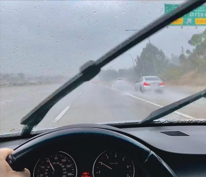 Driving in the rain down the highway.